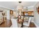 Dining area featuring a glass table, seating for four, with bar and kitchen view at 3481 Lakeside Ne Dr # 1103, Atlanta, GA 30326