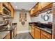 Galley kitchen features stainless appliances, dark countertops, and wooden cabinetry at 3481 Lakeside Ne Dr # 1103, Atlanta, GA 30326