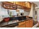 Cozy kitchen offers wood cabinets, granite countertops, and stainless steel appliances at 3481 Lakeside Ne Dr # 1103, Atlanta, GA 30326