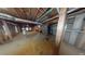 Unfinished basement showing exposed beams, duct work and support columns at 365 Falling Creek Bnd, Duluth, GA 30097
