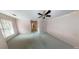 Spacious bedroom featuring a ceiling fan and natural light at 365 Falling Creek Bnd, Duluth, GA 30097