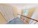 Hallway with a chandelier and curved banister railing at 365 Falling Creek Bnd, Duluth, GA 30097