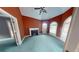 Cozy living room with fireplace, arched windows, and a unique red wall color at 365 Falling Creek Bnd, Duluth, GA 30097