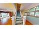 Grand staircase leading to the upper levels of the home, and views of the entry at 365 Falling Creek Bnd, Duluth, GA 30097