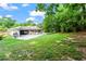 Spacious backyard with lush green grass, and a view of home at 4855 Kendall Ct, Atlanta, GA 30342