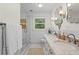 Elegant bathroom featuring a double vanity with marble countertop and a glass shower at 4855 Kendall Ct, Atlanta, GA 30342