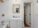 Updated bathroom with a white vanity, subway tile, and modern fixtures at 4855 Kendall Ct, Atlanta, GA 30342