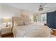 Cozy bedroom with a barn door, neutral decor, and a view to the sunroom at 4855 Kendall Ct, Atlanta, GA 30342