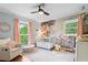 Bright Bedroom with a crib, pink accents, light blue walls, and beautiful mural at 4855 Kendall Ct, Atlanta, GA 30342