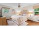 Bright bedroom featuring hardwood floors, neutral paint, and well-lit windows at 4855 Kendall Ct, Atlanta, GA 30342