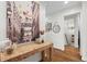 Stylish entryway with hardwood floors, designer console table, and artistic wall decor, showcasing modern elegance at 4855 Kendall Ct, Atlanta, GA 30342