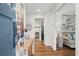 Bright entryway featuring hardwood floors, elegant decor, and a view into the living room, creating a welcoming ambiance at 4855 Kendall Ct, Atlanta, GA 30342