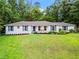 Charming home with a beautiful lawn and manicured landscaping at 4855 Kendall Ct, Atlanta, GA 30342