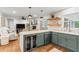 Open kitchen and living room features stainless steel appliances and a wine fridge at 4855 Kendall Ct, Atlanta, GA 30342