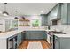 Charming kitchen with open shelving, stainless steel appliances, and shaker style cabinets at 4855 Kendall Ct, Atlanta, GA 30342