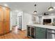 Open-concept kitchen with stainless steel appliances and a wine fridge at 4855 Kendall Ct, Atlanta, GA 30342