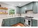 Cozy kitchen featuring shaker cabinets, stainless steel appliances, and white subway tile backsplash at 4855 Kendall Ct, Atlanta, GA 30342