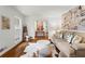 Comfortable living room with hardwood floors, chic furnishings, and a view into the elegantly decorated hallway at 4855 Kendall Ct, Atlanta, GA 30342