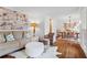 Spacious living room with hardwood floors, stylish seating, and an open view into the elegant dining area at 4855 Kendall Ct, Atlanta, GA 30342