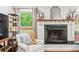 Cozy living room with fireplace and view of the backyard at 4855 Kendall Ct, Atlanta, GA 30342