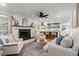 Bright open concept living room with fireplace and view of the kitchen at 4855 Kendall Ct, Atlanta, GA 30342