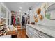 Spacious walk-in closet with custom shelves, storage, natural light, and hardwood floors at 4855 Kendall Ct, Atlanta, GA 30342