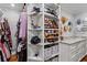Organized walk-in closet with open shelves, drawers, and marble countertop at 4855 Kendall Ct, Atlanta, GA 30342