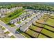 Aerial view of a quiet community featuring manicured lawns, and sidewalks for easy neighborhood access at 517 Hyde Ridge Trl, Loganville, GA 30052