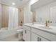 Modern bathroom featuring double vanity, tile floors, and bathtub with tiled shower at 517 Hyde Ridge Trl, Loganville, GA 30052