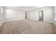 Large main bedroom with soft carpet, ensuite bathroom, and bright natural light at 517 Hyde Ridge Trl, Loganville, GA 30052
