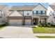 Beautiful two-story home with a brick and siding exterior, a spacious driveway and a well-manicured lawn at 517 Hyde Ridge Trl, Loganville, GA 30052