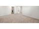 Hallway with access to Laundry Room and featuring neutral carpeting at 517 Hyde Ridge Trl, Loganville, GA 30052