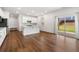 Spacious kitchen with white cabinets, stainless steel appliances, and a view of the backyard from the dining area at 517 Hyde Ridge Trl, Loganville, GA 30052