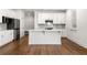 Beautiful kitchen with white cabinets, a large island, and stainless steel appliances for modern style at 517 Hyde Ridge Trl, Loganville, GA 30052