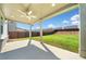 Spacious covered patio overlooking a well-manicured backyard with a privacy fence at 517 Hyde Ridge Trl, Loganville, GA 30052