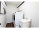 Convenient laundry room with front-load washer, dryer, utility sink and wooden counter at 602 Belshire Dr, Acworth, GA 30102