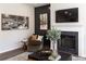 Cozy seating area with fireplace, featuring wall art, accent wall, and elegant decor at 602 Belshire Dr, Acworth, GA 30102