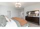 Serene main bedroom features a plush bed and a dark dresser with modern decor at 602 Belshire Dr, Acworth, GA 30102