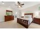 Nicely decorated bedroom with carpet and dark wood furniture and a ceiling fan at 2655 Appian Way, Decatur, GA 30030
