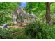 The exterior view of a charming home with lush landscaping and a welcoming front porch at 2655 Appian Way, Decatur, GA 30030