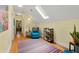 Hallway with a skylight and seating area leading to other rooms in the home at 2655 Appian Way, Decatur, GA 30030