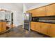 Modern kitchen featuring custom cabinets, stainless steel appliances, and slate tile floors at 2655 Appian Way, Decatur, GA 30030