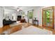 Bright living room featuring hardwood floors, large windows, and a view of the front porch at 2655 Appian Way, Decatur, GA 30030