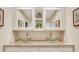 Dual vessel sinks with granite countertops create a luxurious and functional bathroom vanity area at 2715 Woods Ridge Dr, Alpharetta, GA 30022