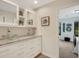 Bright bathroom featuring double vessel sinks, granite countertops, and an abundance of storage at 2715 Woods Ridge Dr, Alpharetta, GA 30022