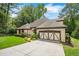 Beautiful one-story home featuring well-kept landscaping, a spacious driveway, and a 2-car garage at 2715 Woods Ridge Dr, Alpharetta, GA 30022