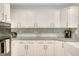 Bright kitchen with updated white cabinets, gray countertops, and stainless steel appliances at 2715 Woods Ridge Dr, Alpharetta, GA 30022