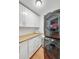 Well-organized laundry room with modern washer/dryer units and ample storage space at 2715 Woods Ridge Dr, Alpharetta, GA 30022