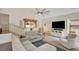Spacious living room with carpet, neutral tones, and stairs to a lower level at 2715 Woods Ridge Dr, Alpharetta, GA 30022