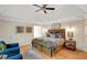 Inviting primary bedroom showcases tray ceilings, hardwood floors, and stylish decor at 2715 Woods Ridge Dr, Alpharetta, GA 30022